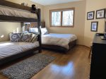 Third bedroom with bunks and queen bed